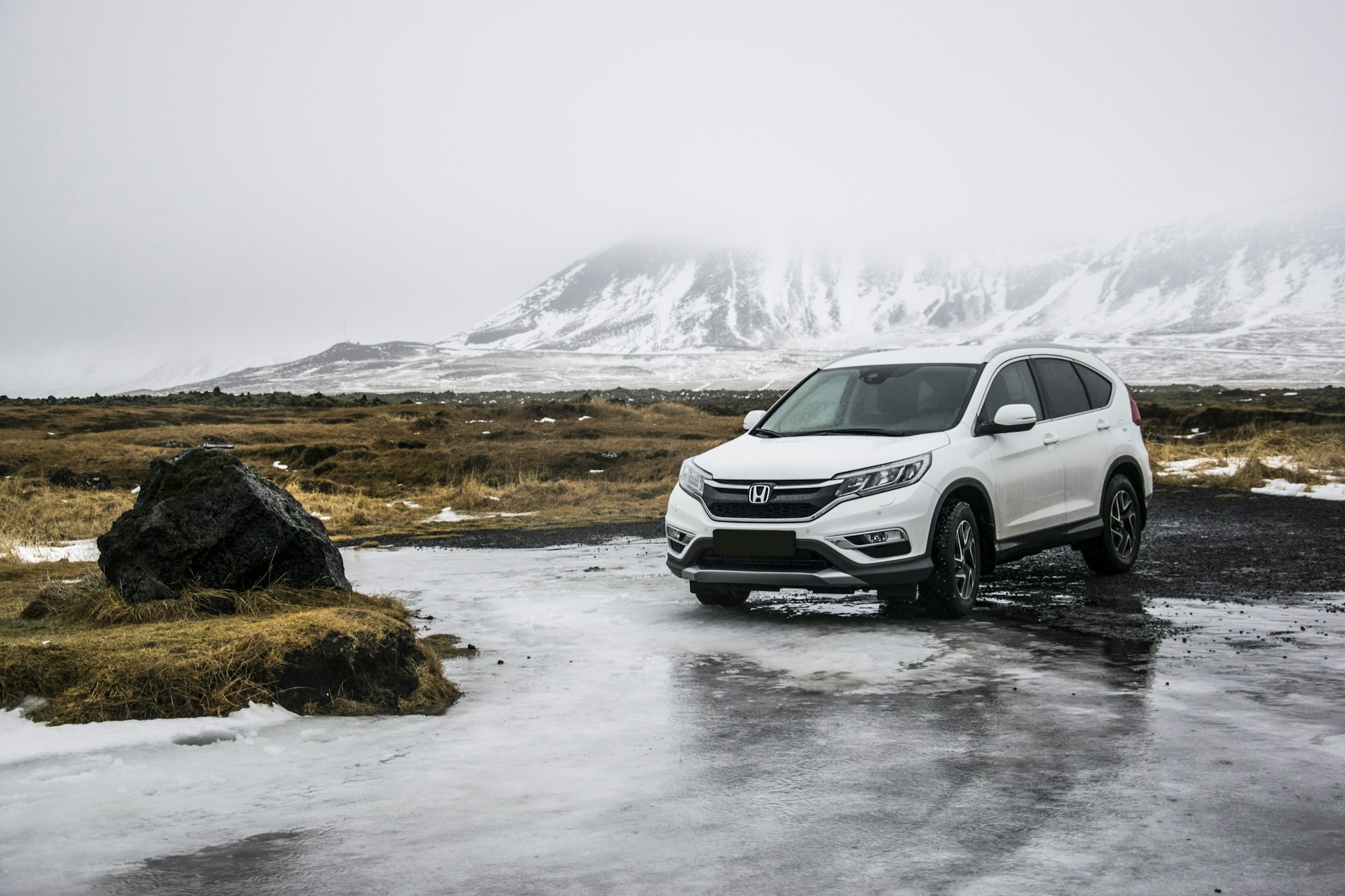 Comfortable white SUV on a mountain trip
